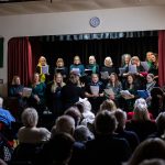 A choir singing at the 2022 BRACE Christmas Concert.