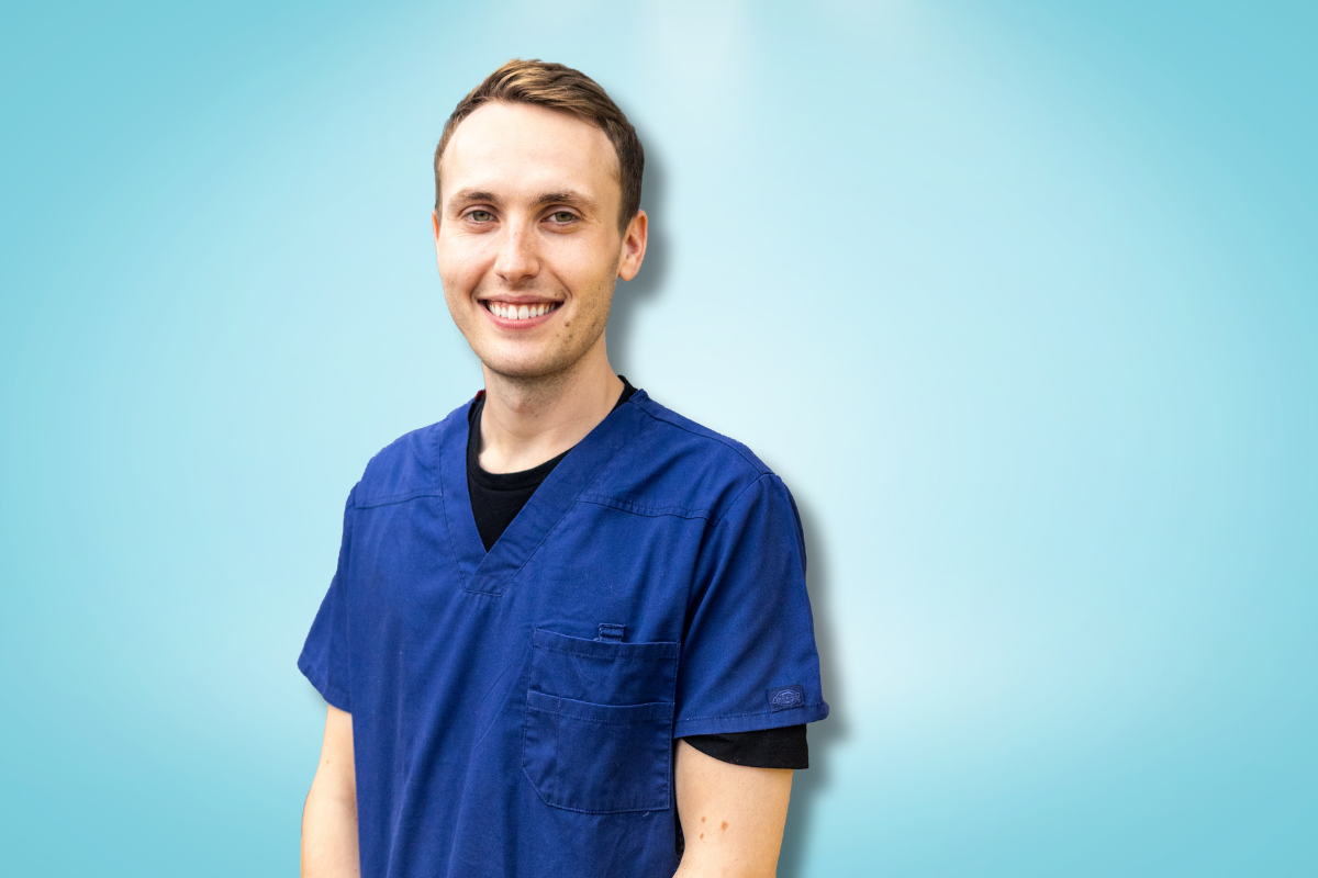 A portrait of Dr Matthew Wright with a light blue background.