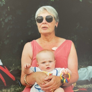 Jean wearing sunglasses and holding baby Robyn.