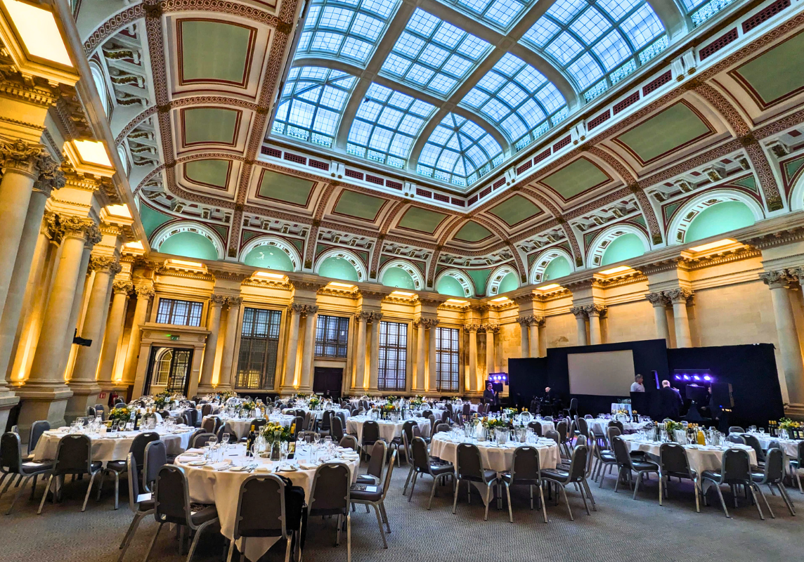 A photo of The Sansovino Hall event space in the Bristol Harbour Hotel, with many round tables and chairs.