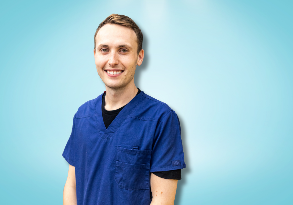 A portrait of Dr Matthew Wright with a light blue background.